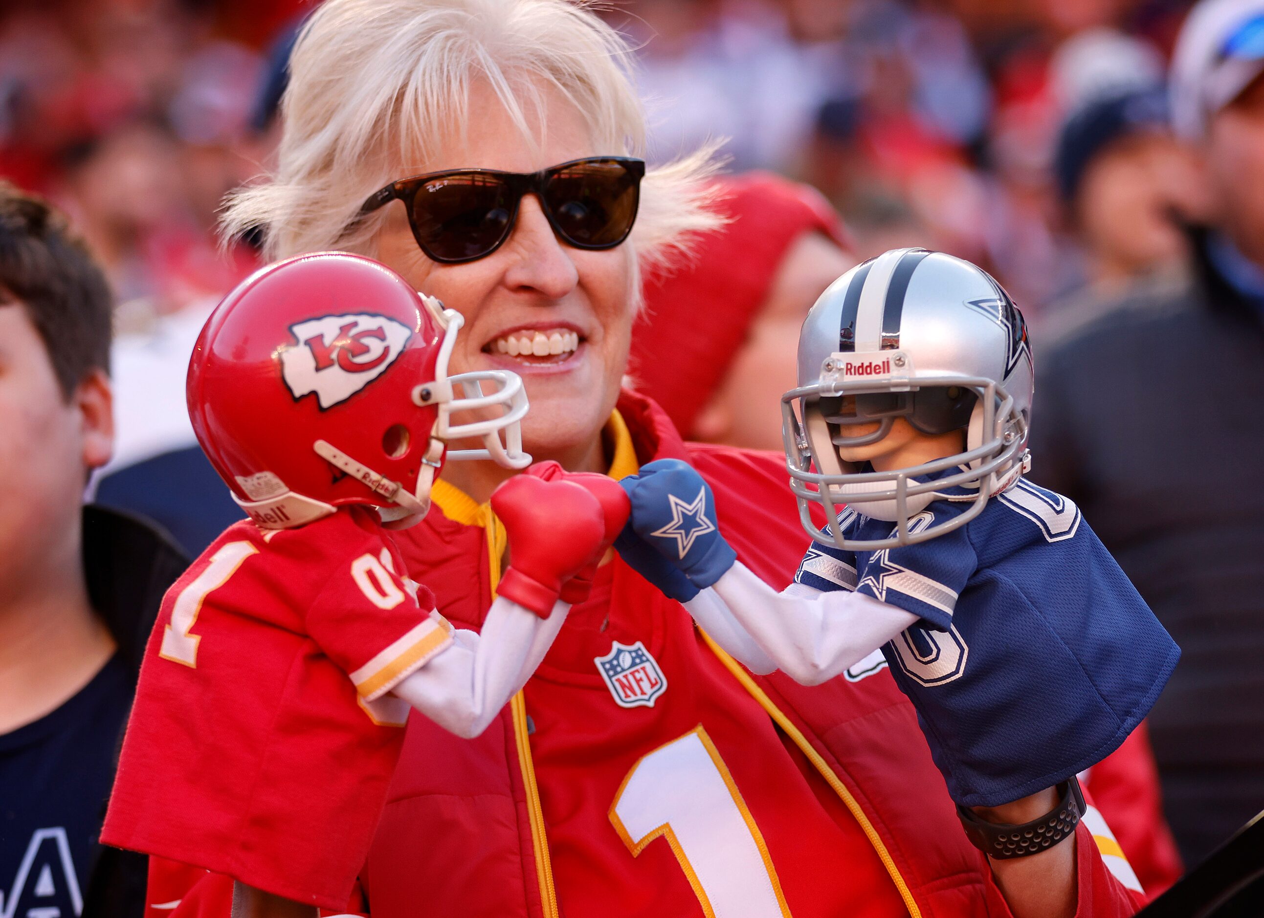 Janel Carbajo, known to many as the puppet lady, has her Kansas City Chiefs and Dallas...