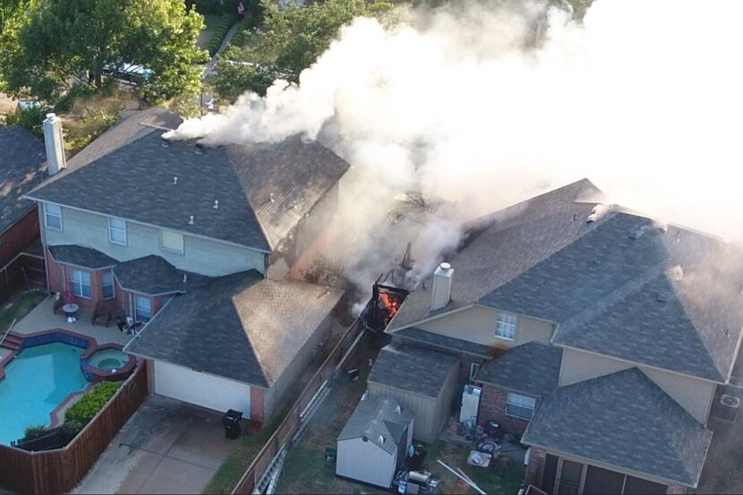 Heavy smoke and fire were showing from two homes in the 8000 block of Burleigh Street when...