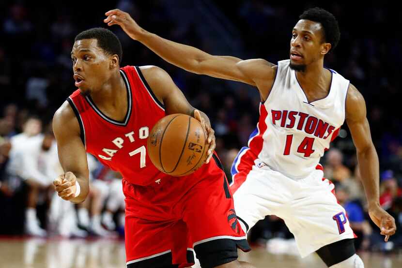 AUBURN HILLS, MI - APRIL 05: Kyle Lowry #7 of the Toronto Raptors tries to escape the...