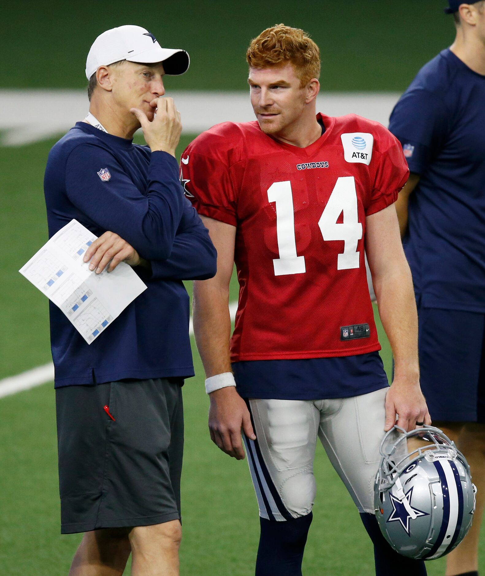 Dallas Cowboys quarterbacks coach Doug Nussmeier talks with Dallas Cowboys quarterback Andy...