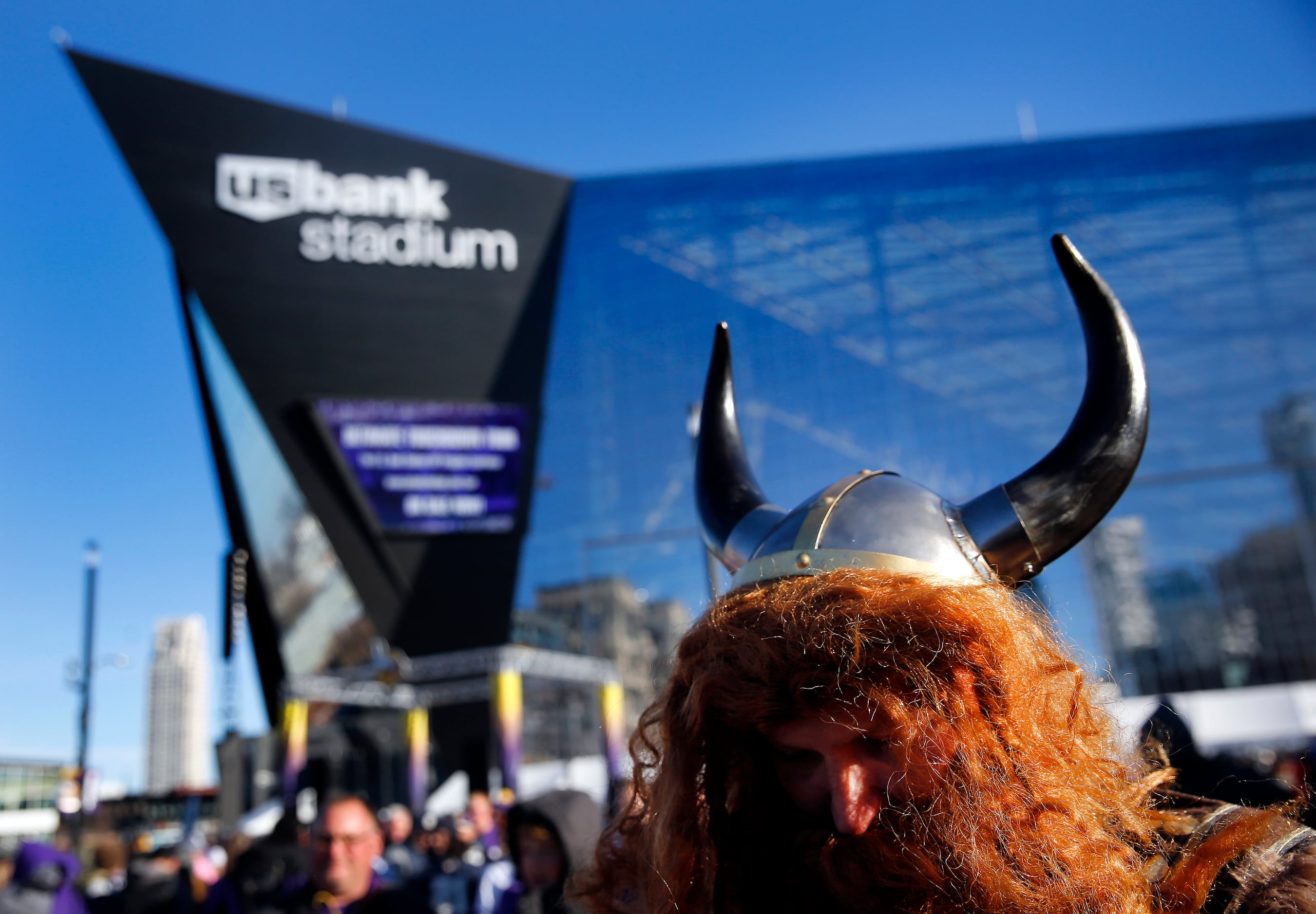 A Minnesota Vikings fan cheers during the opening ceremonies of an