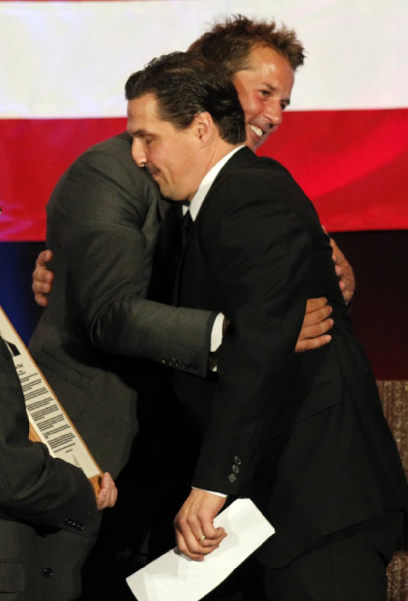 U.S. Hockey Hall of Fame Class of 2012 inductee Ed Olczyk and Mike Modano hug as Olczyk is...