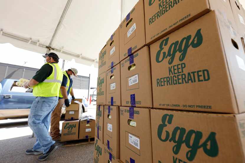 FILE - Cases of eggs from Cal-Maine Foods, Inc., await to be handed out by the Mississippi...