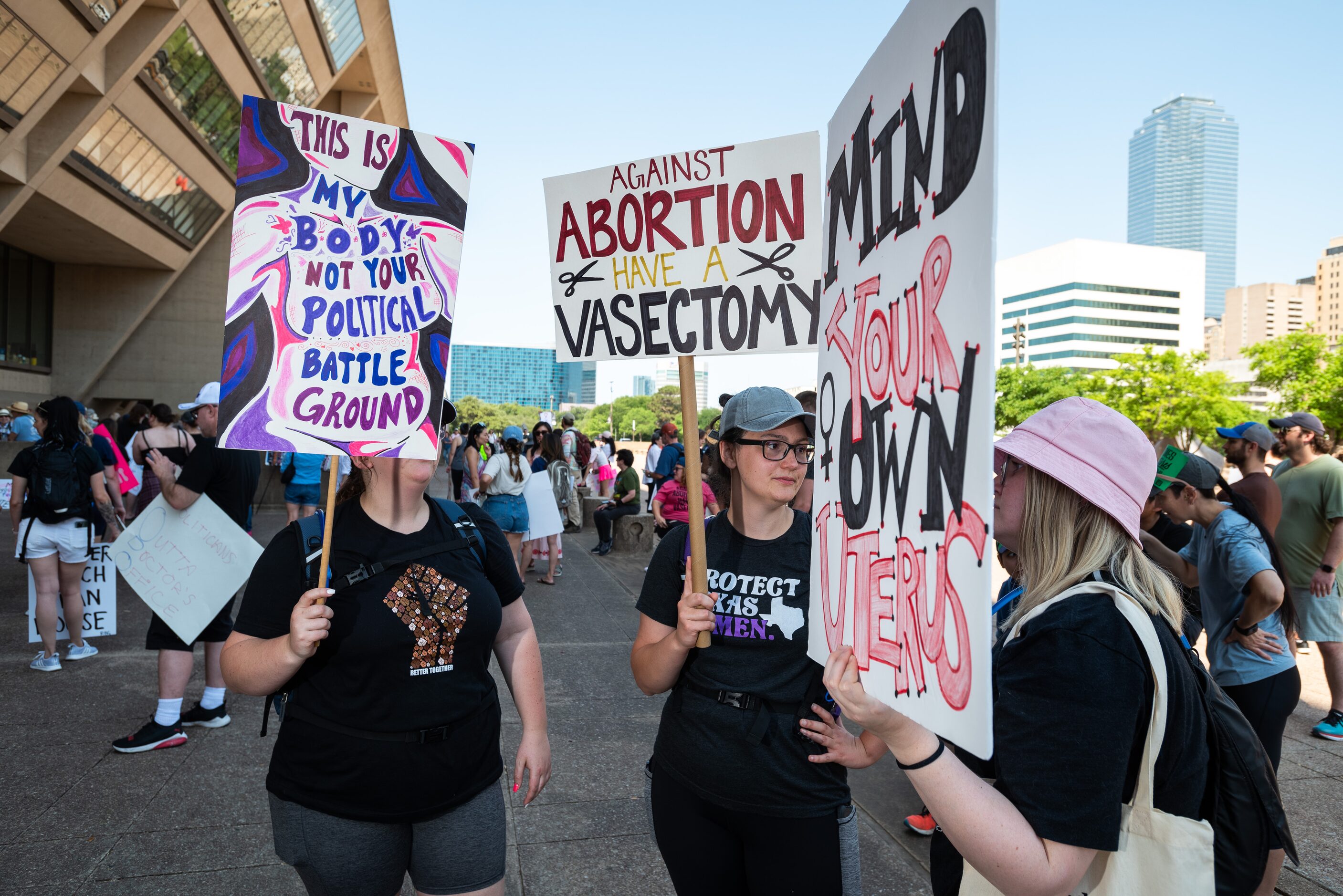 From left, Whitney Walker, 25, Brooke Walker, 28, of Austin, and Emma Beckerman, 28, talk to...