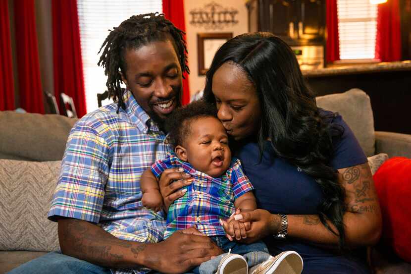 Lineisha Marshall, Brent Pointer and their baby son, Broaddrick Pointer, pose for a photo at...