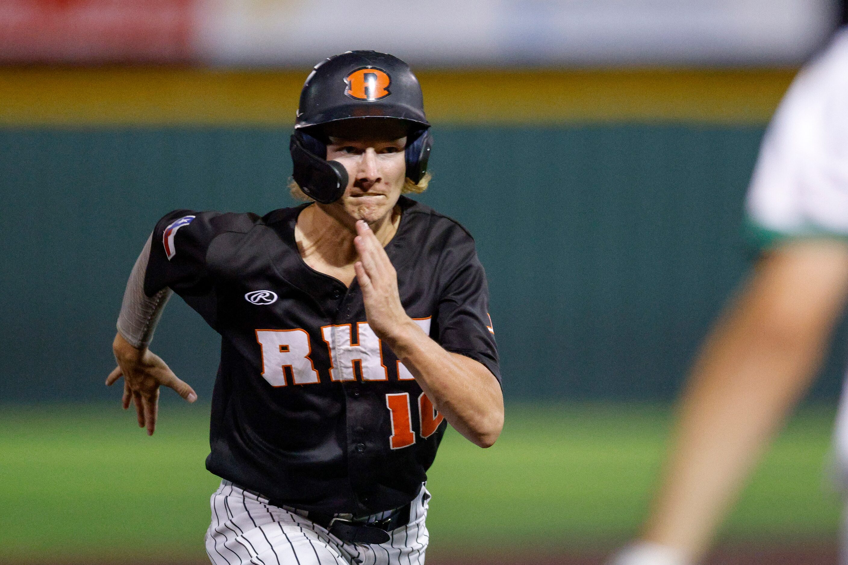 Rockwall third baseman Pearson Riebock (10) runs to third base during a Class 6A Region II...