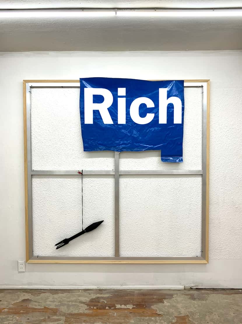 Mark Flood's "Rich" (2020), vinyl on aluminum and wood stretcher bar, with dummy munition...