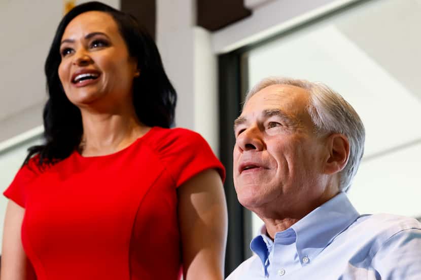 House District 33 Republican candidate Katrina Pierson (left) and Gov. Greg Abbott pose for...