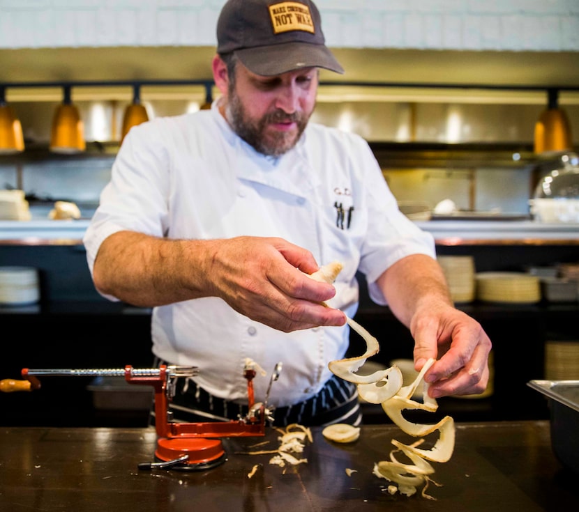 Chef Graham Dodds makes pickled black radish using a spiralizer on Thursday, March 31, 2016...