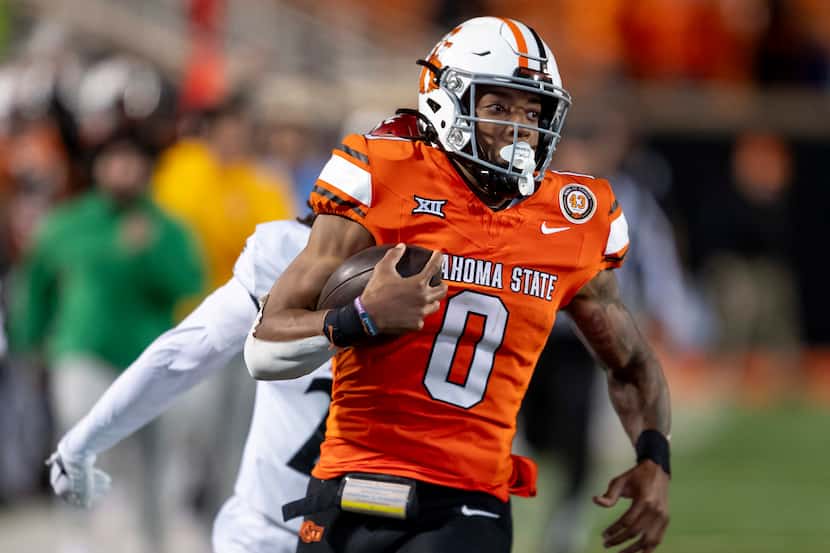FILE - Oklahoma State running back Ollie Gordon II (0) runs for a touchdown during the...