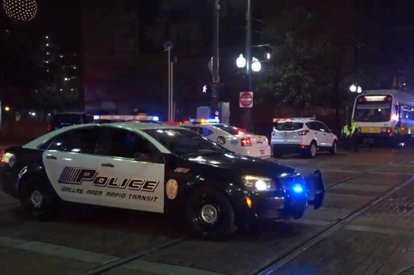 Dallas Area Rapid Transit police block off streets near where someone became trapped under a...
