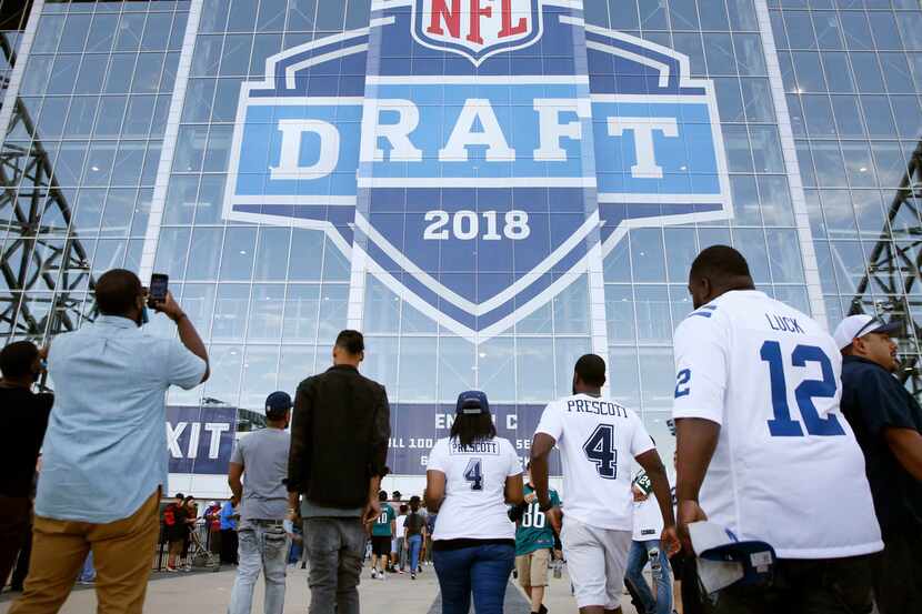 Fans enter the stadium for the 2018 NFL draft at AT&T Stadium in Arlington, Texas on...