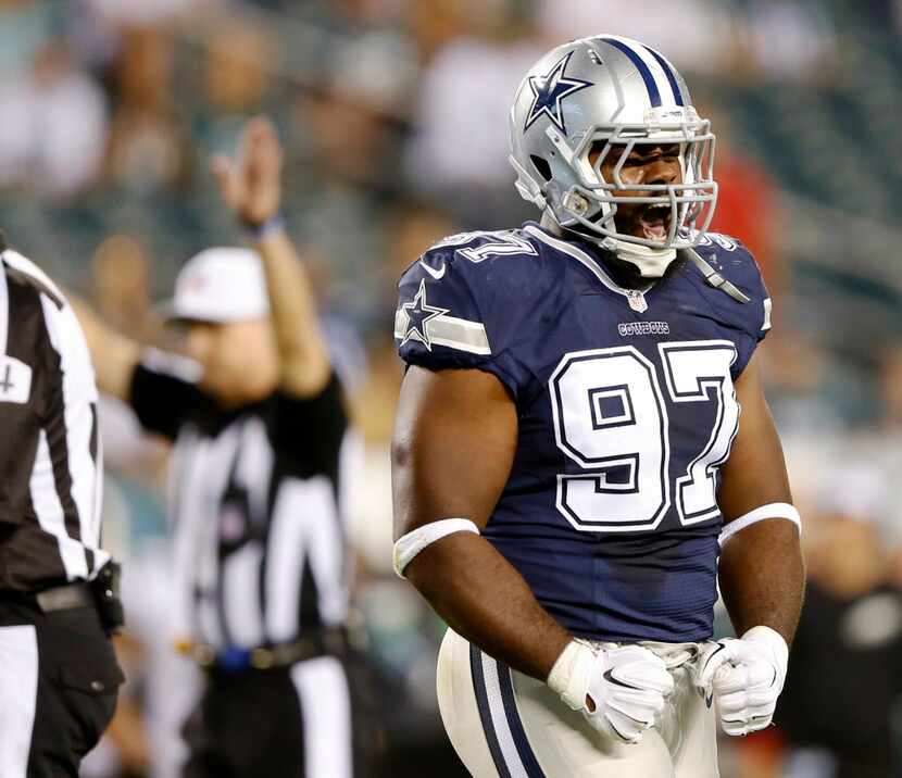 Dallas Cowboys defensive tackle Terrell McClain (97) celebrates after stopping the run on a...