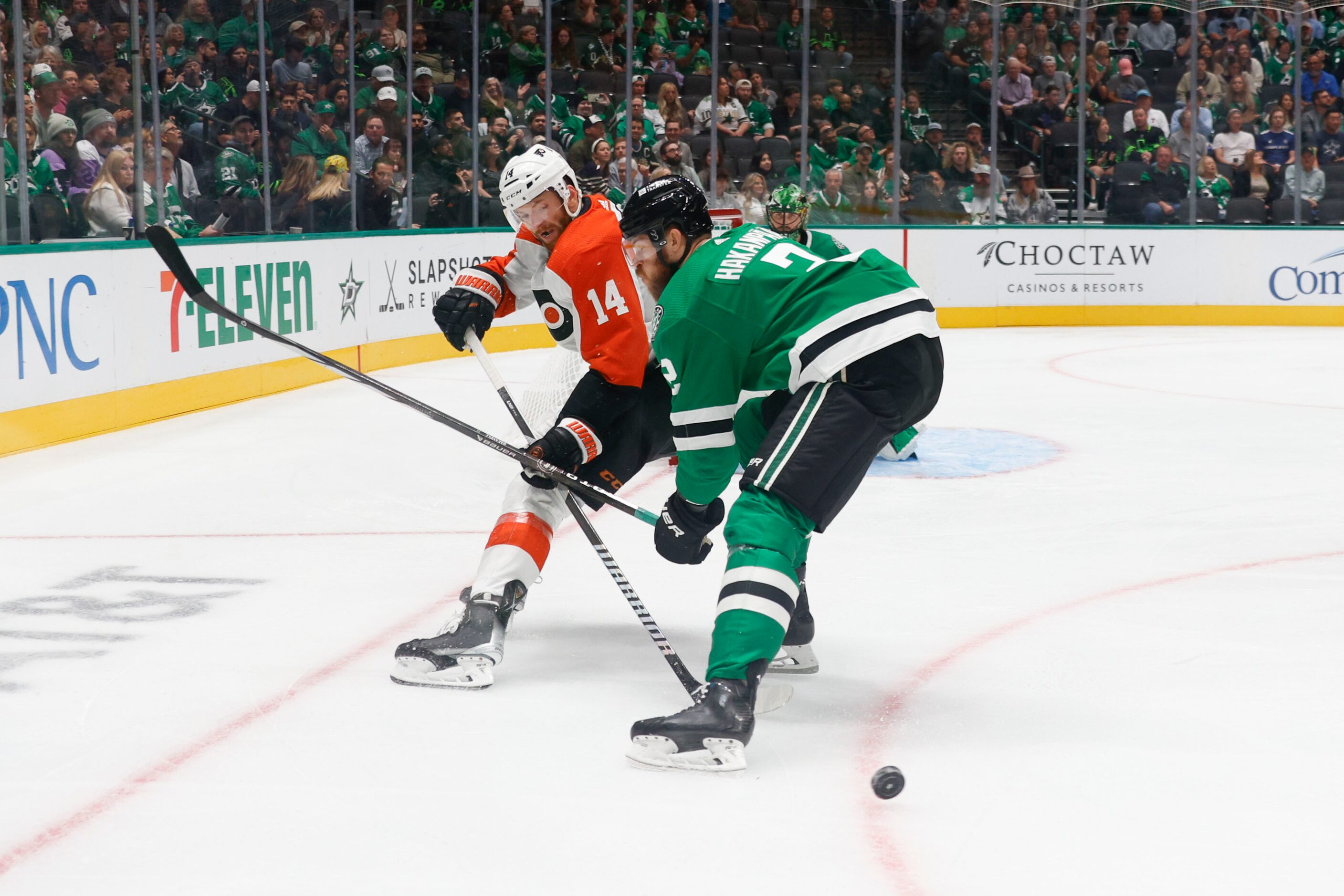 Philadelphia Flyers center Sean Couturier (left) and Dallas Stars defenseman Jani Hakanpaa...