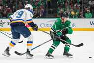 Dallas Stars defenseman Nils Lundkvist (5) takes the puck away from St. Louis Blues left...