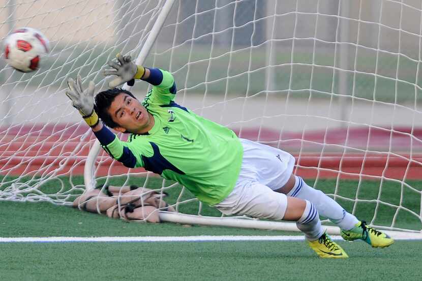 Hebron's Abraham Pina can't make the save on a Coppell goal in the first half during a boys...