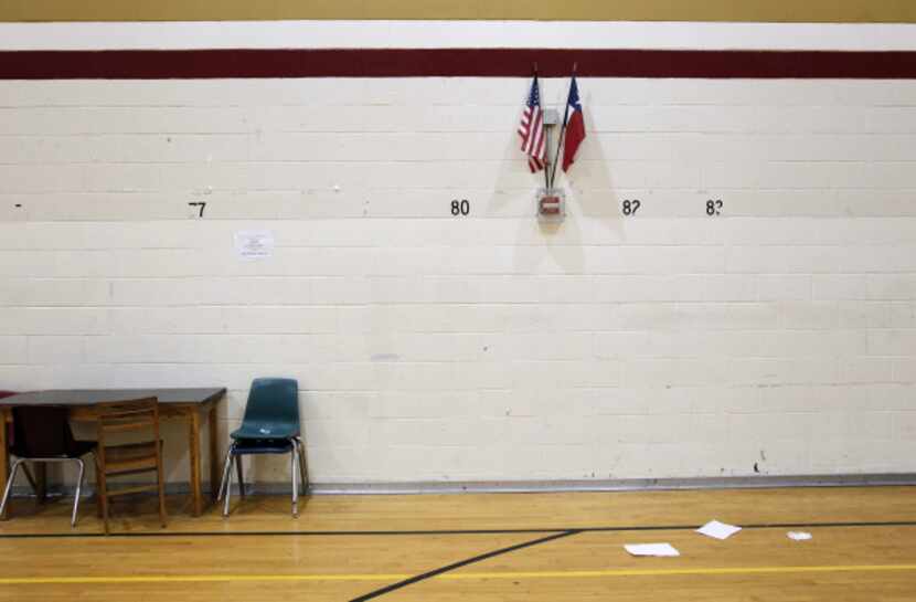 Papers on the gym floor were among the few signs of life after Hulcy Middle School shut down...