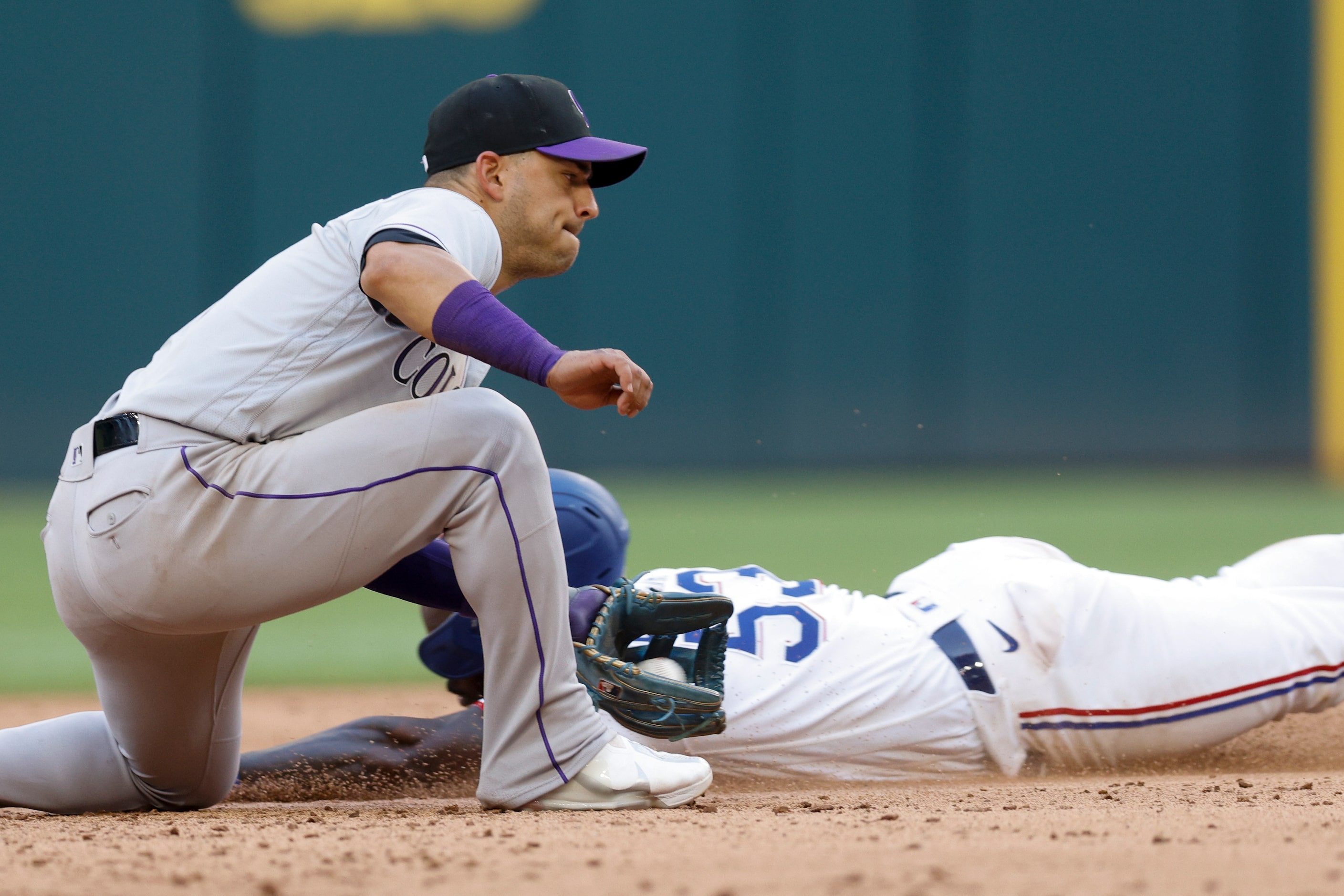 Texas Rangers center fielder Adolis Garcia (53) is caught stealing by Colorado Rockies...