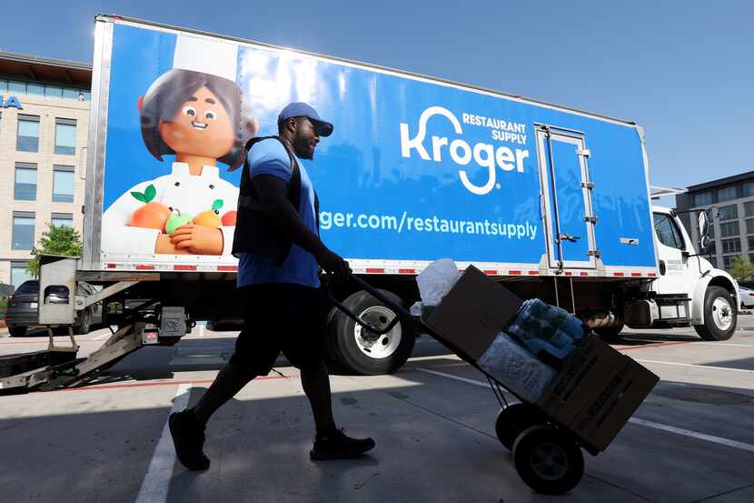 Ron Law, a Kroger Restaurant Supply delivery driver, makes a food delivery to Eno's Pizza...