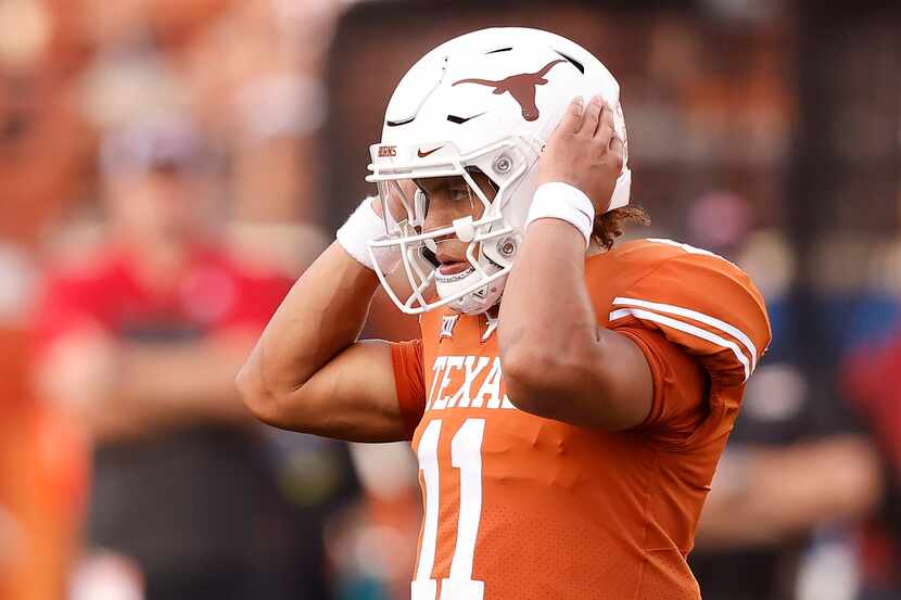 Texas Longhorns quarterback Casey Thompson (11) listens for the next play in the second half...