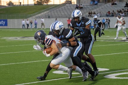 Kilgore-Seven Lakes: Paetow's Alex Kilgore takes down Seven Lakes Jake Farris during...