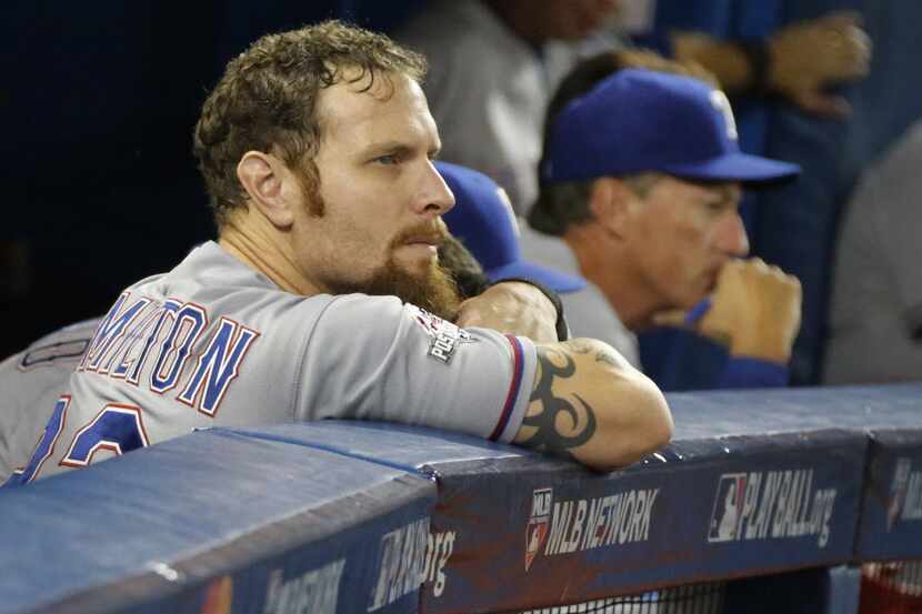 Texas Rangers left fielder Josh Hamilton (32) watches the game from the dugout during Game 5...