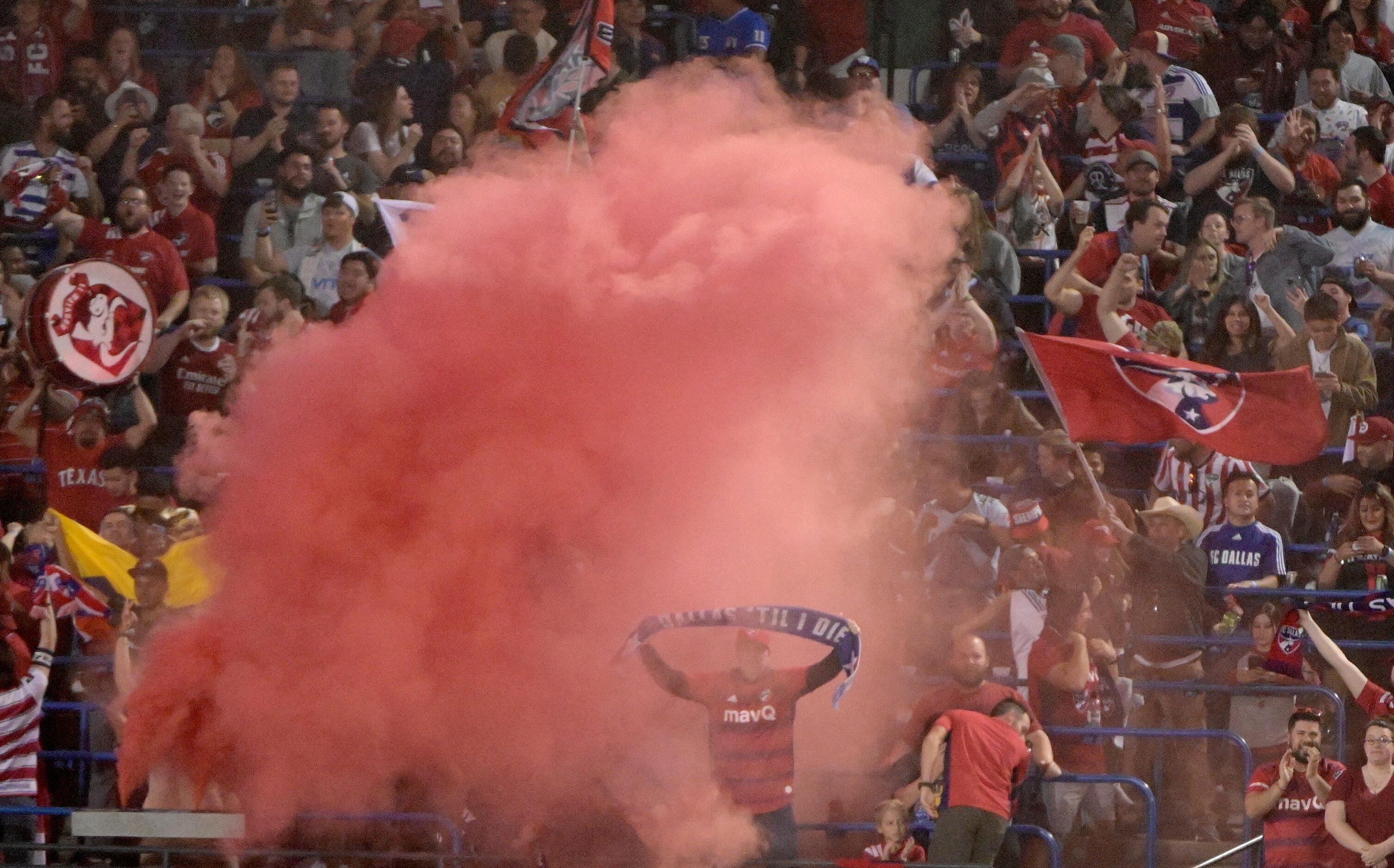 FC Dallas fans cheer after a goal in the first half during a MLS soccer game between the...