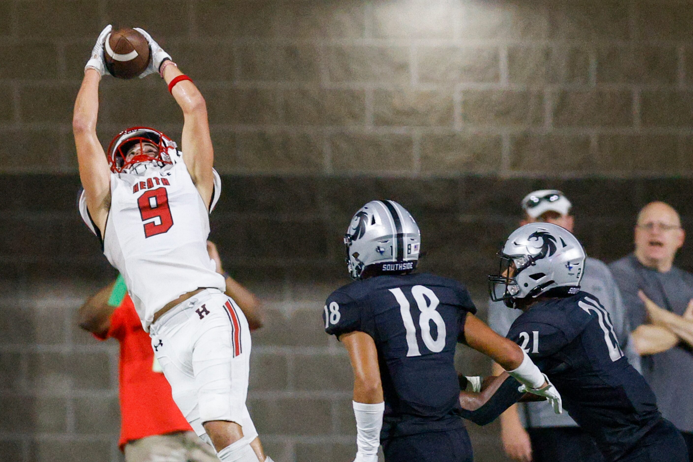 Rockwall-Heath wide receiver Fletcher Fierro (9) fails to complete the catch over Denton...