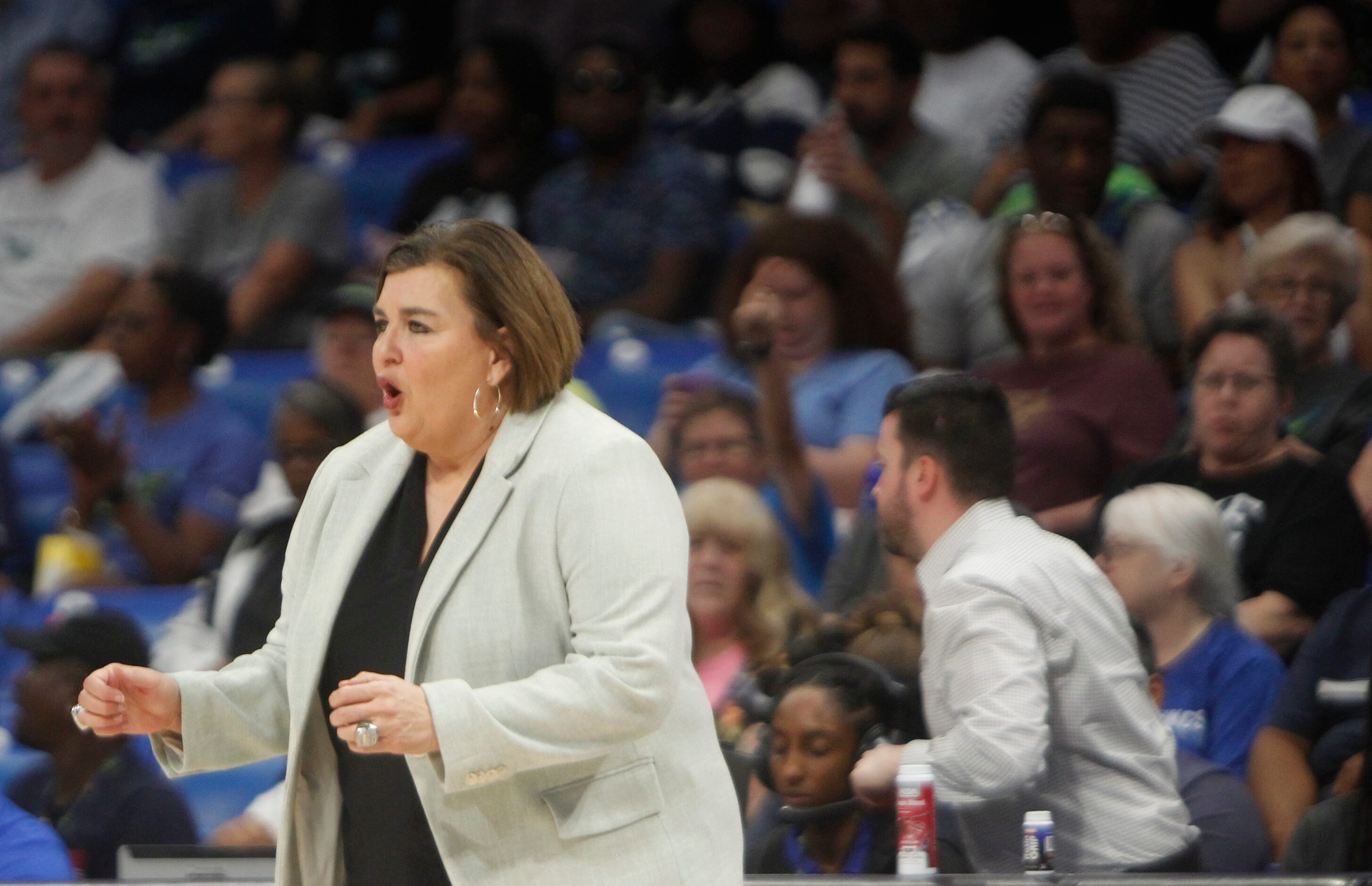 Dallas Wings head coach Latricia Trammell works to inspire her players during first half...