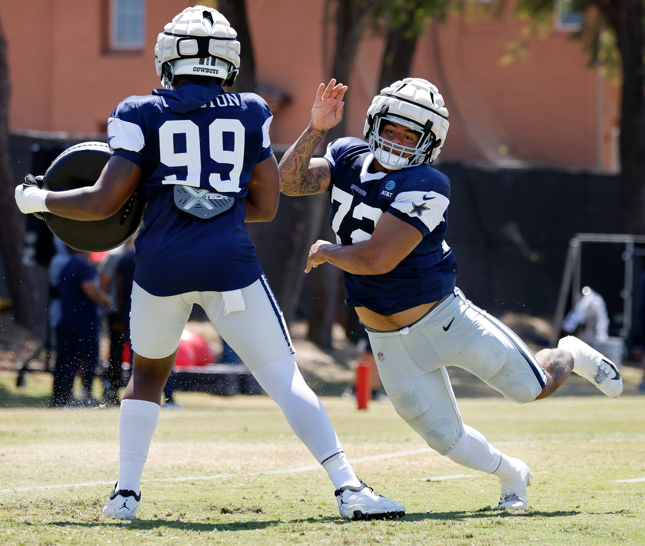 Dallas Cowboys defensive tackle Trysten Hill (72) runs a pass rush drill past defensive end...