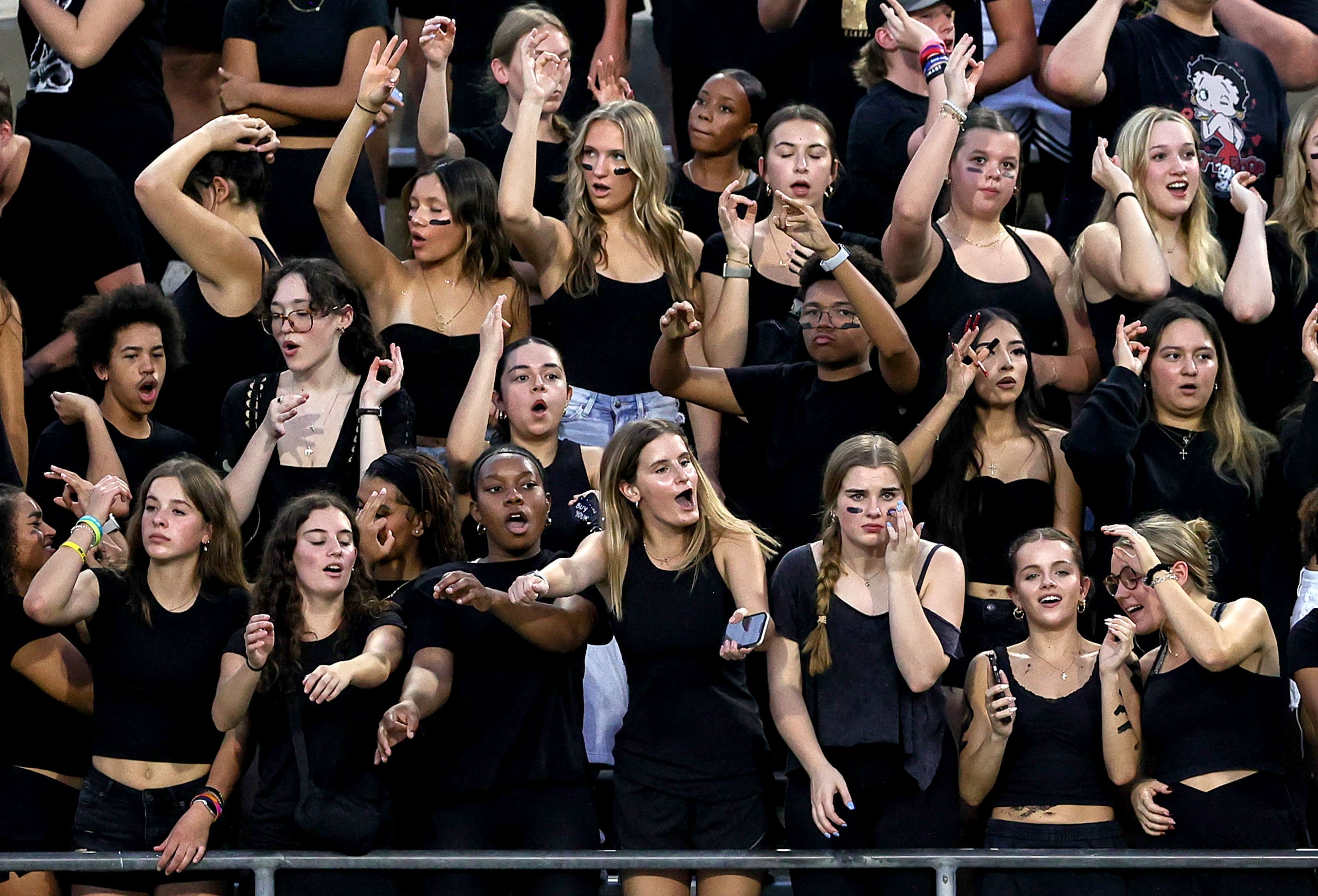 The Denton Ryan student body cheer on their Raiders against Mansfield Timberview in a high...