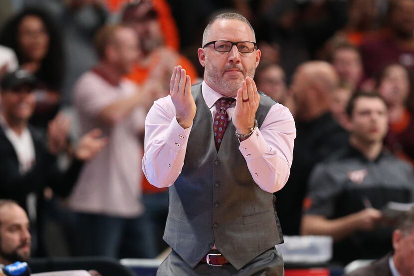 SAN JOSE, CALIFORNIA - MARCH 24: Head coach Buzz Williams of the Virginia Tech Hokies reacts...