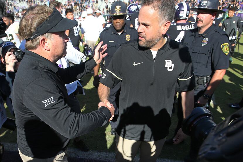 TCU head coach Gary Patterson shakes hands with Baylor head coach Matt Rhule after the...