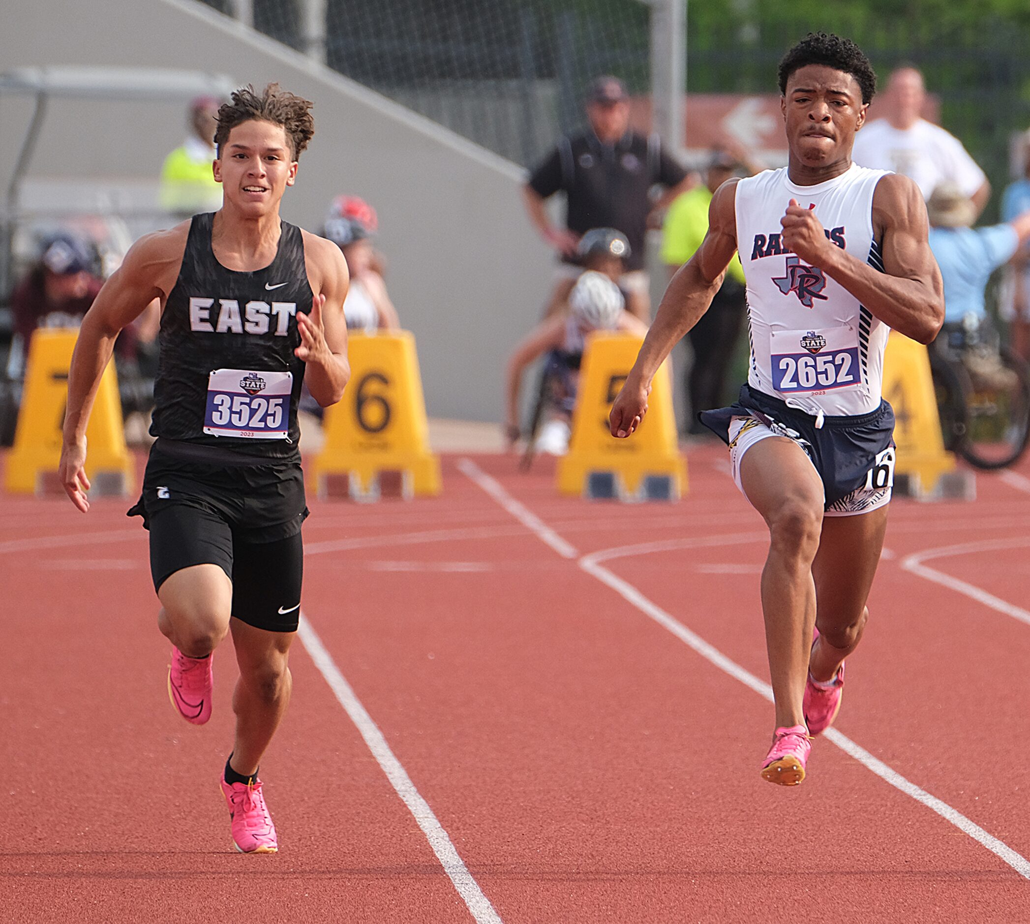 Josiyah Taylor of Denton Ryan races Gael Romo of Weslaco East in the boys 100 M dash at the...