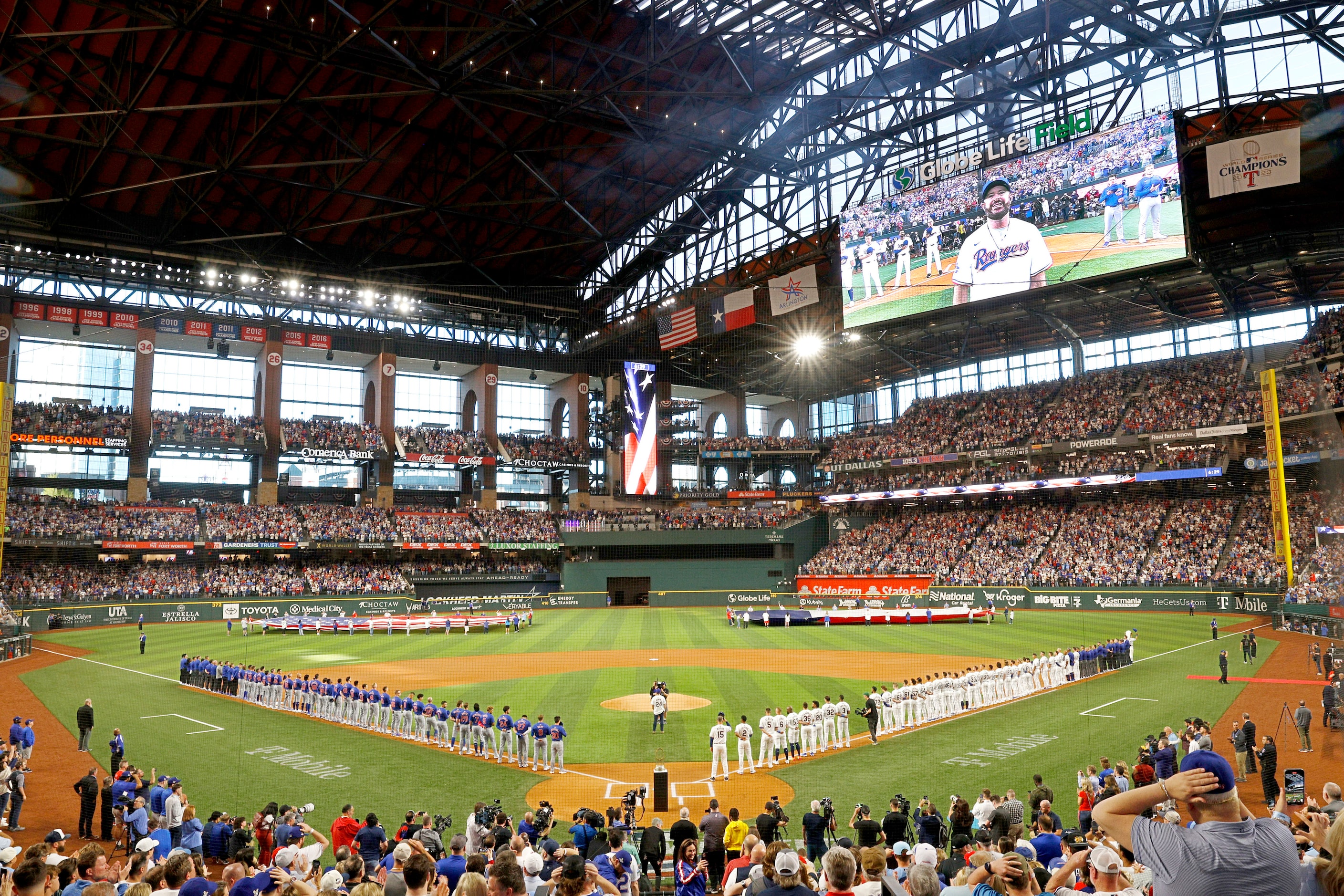 Texas country singer/songwriter Wade Bowen sings the national anthem before an opening day...