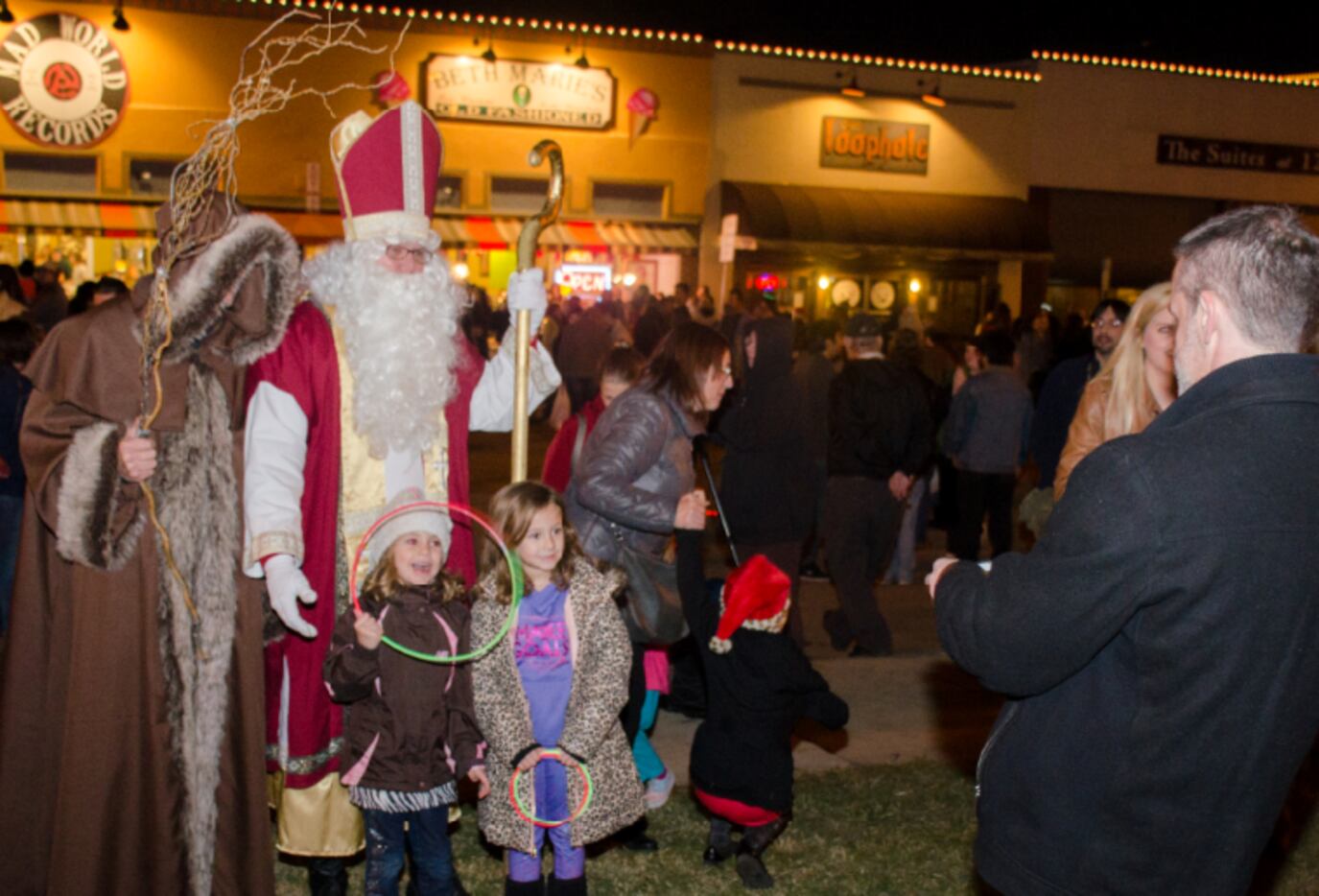 Saint Nicholas and Jack Frost pose with pint-sized festival goers at the Denton Holiday...