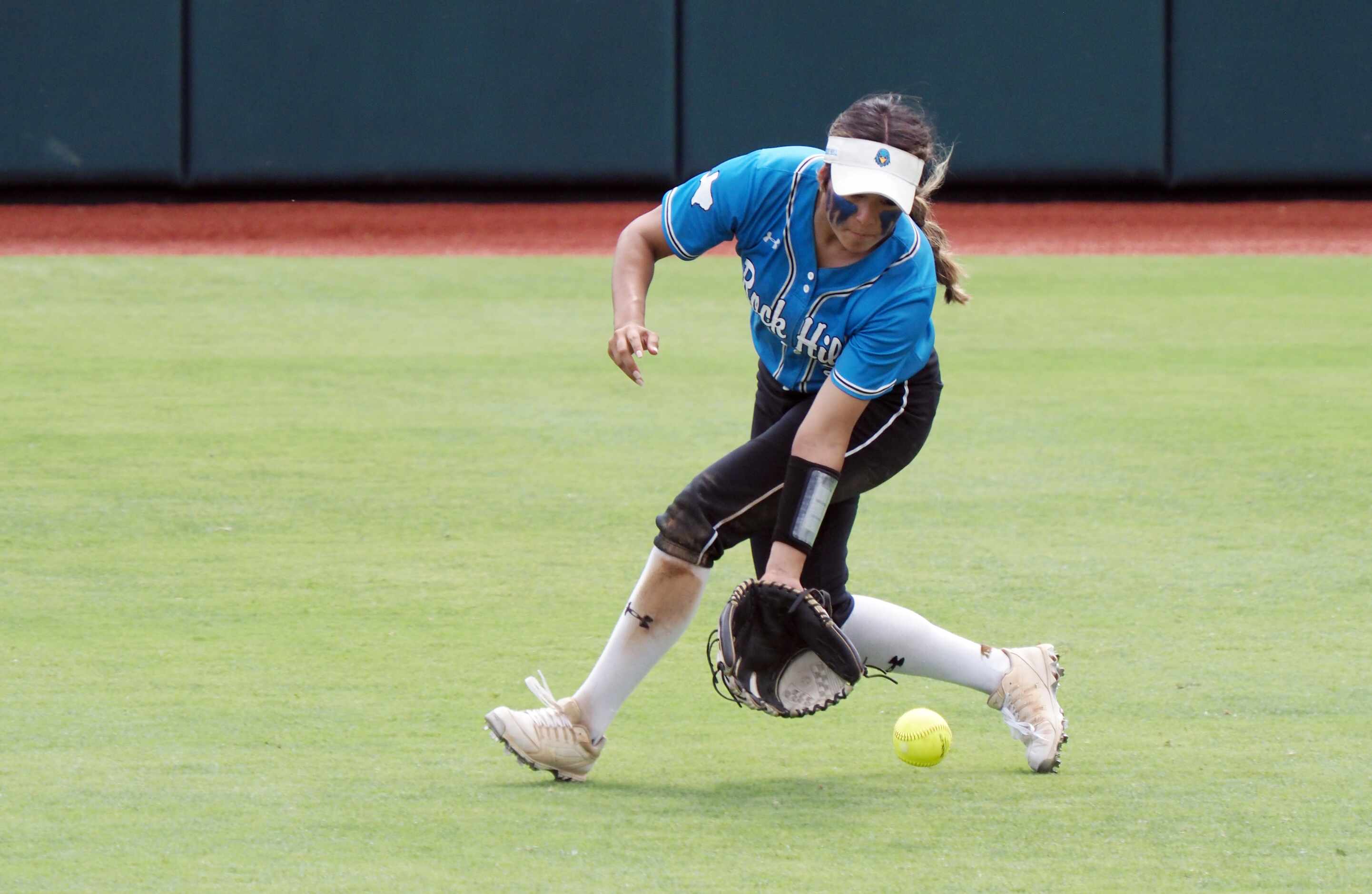 Prosper Rock Hill right fielder Emily Alvarez collects the ball against Montgomery Lake...