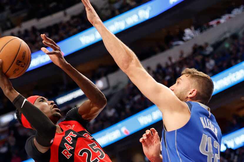 Dallas Mavericks forward Maxi Kleber (42) defends as Toronto Raptors forward Chris Boucher...