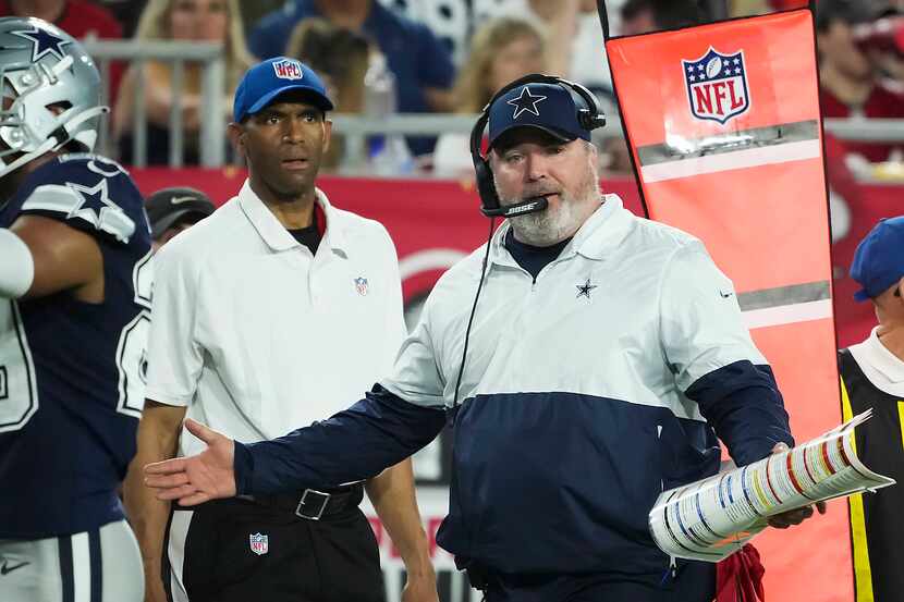Dallas Cowboys head coach Mike McCarthy argues a call during the first half of an NFL...