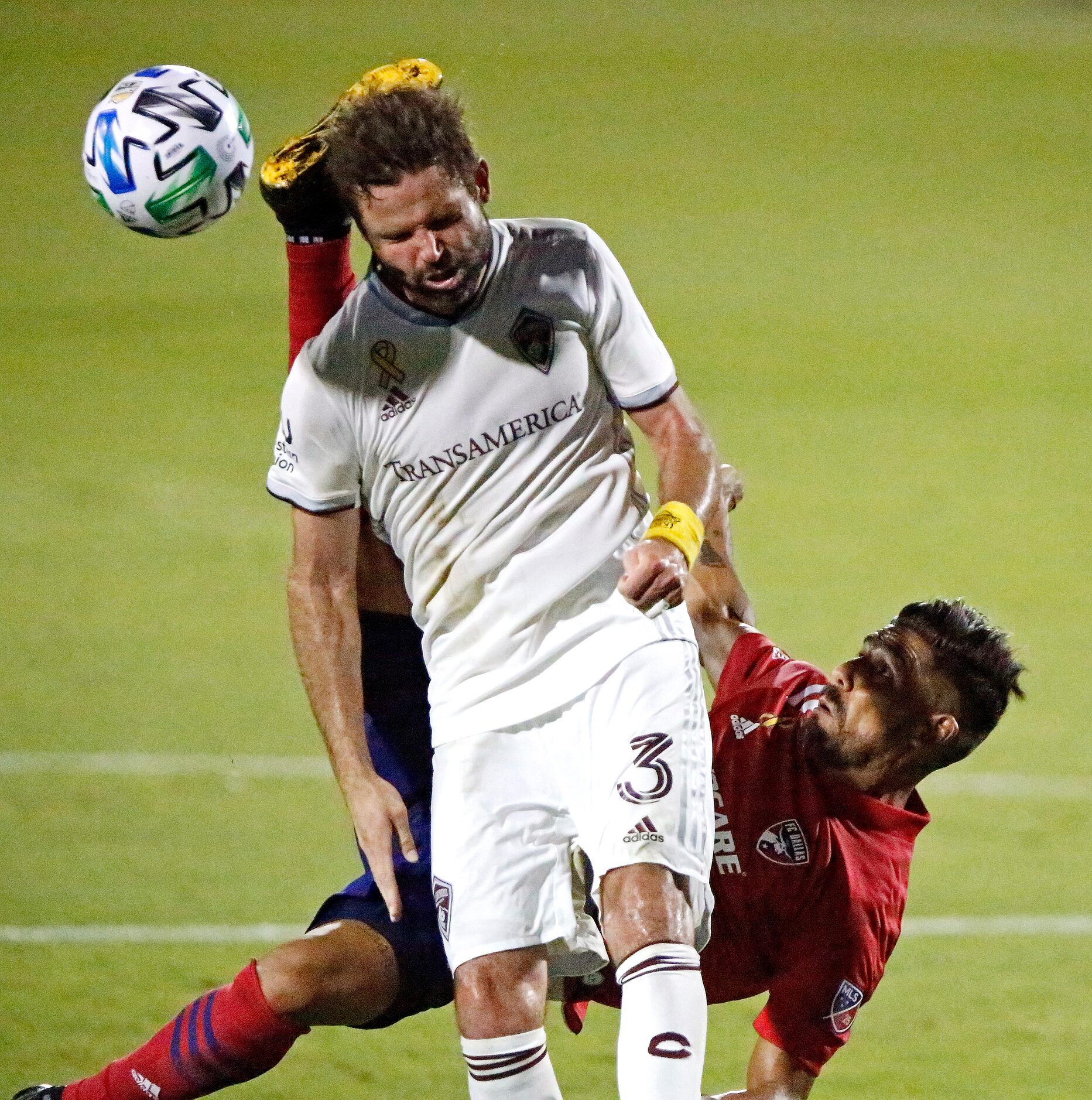 Colorado Rapids defender Drew Moor (3) gets a boot to the head from FC Dallas forward Franco...