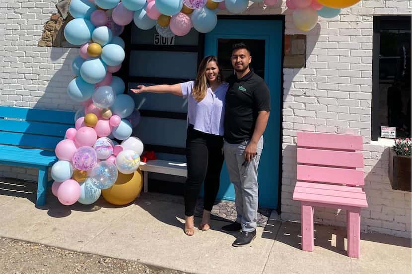 Zoya and Gerardo Hernandez stand in front of newly opened Scoop N' Buns on April 20, 2021.