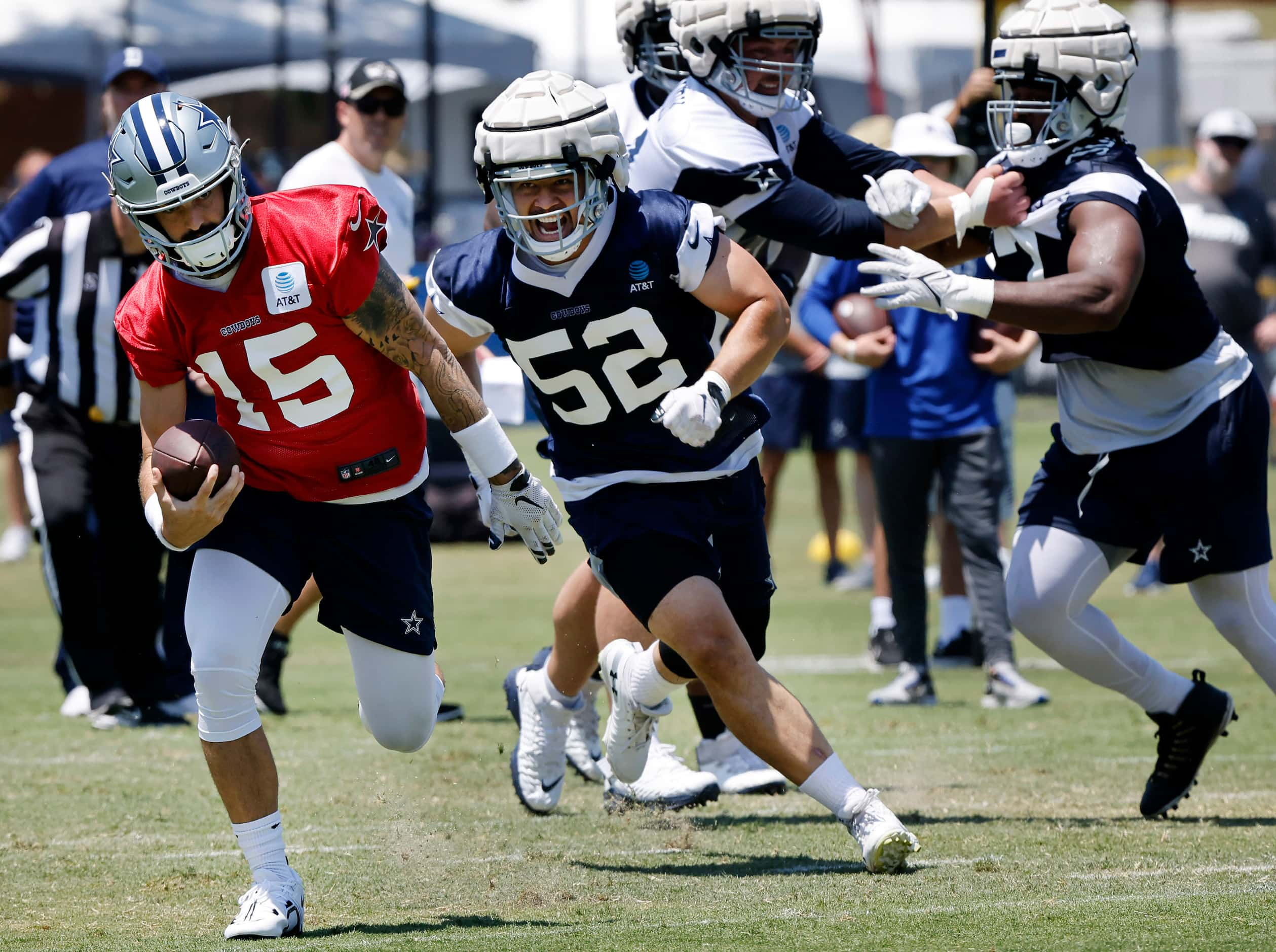 Dallas Cowboys defensive end Mike Tafua (52) chases down quarterback Will Grier (15) on a...