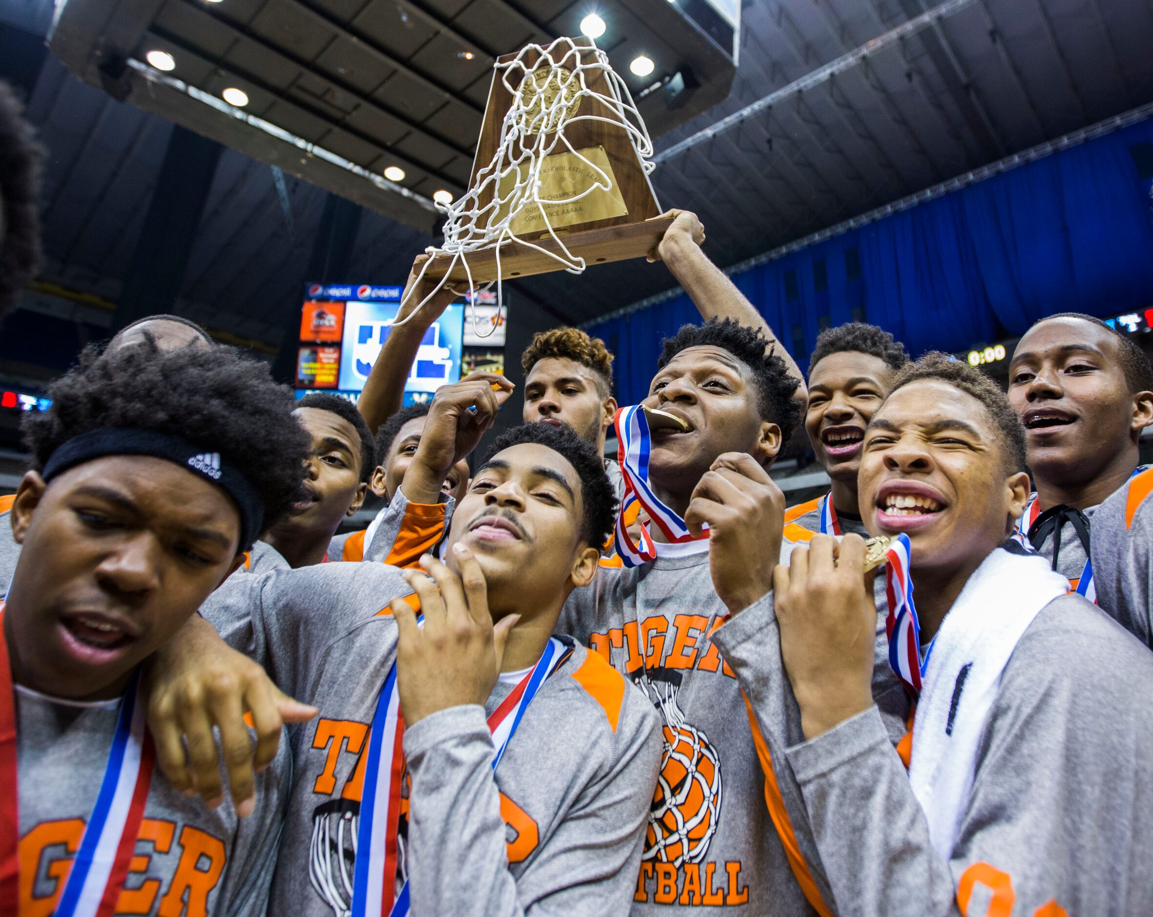 Lancaster celebrates a 59-47 win over Beaumont Ozen at their UIL Class 5A state championship...