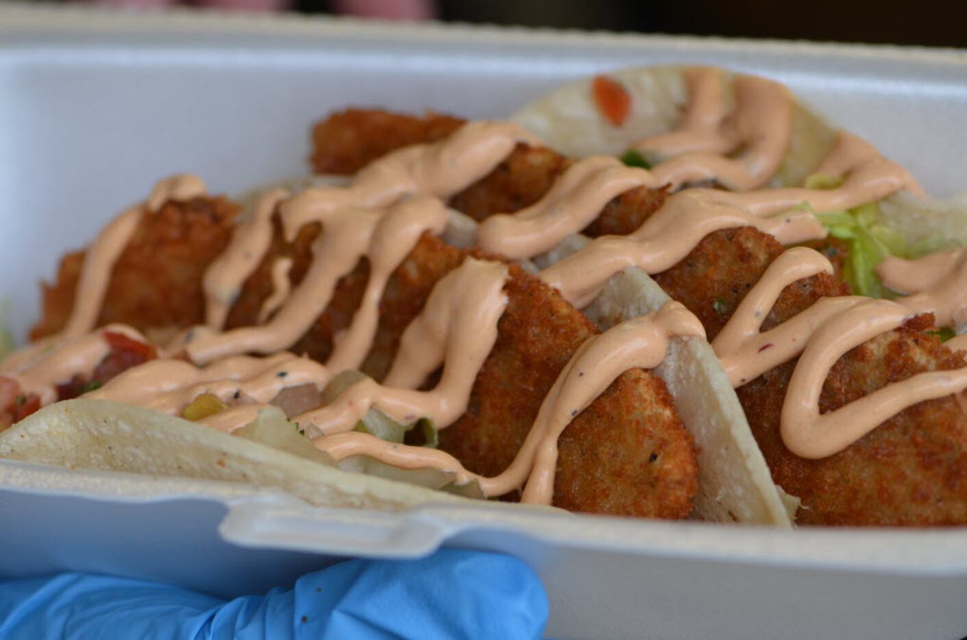 Fish Tacos from the Jamaica Beach Shrimp 'n Stuff food truck are easy to handle and quick to...