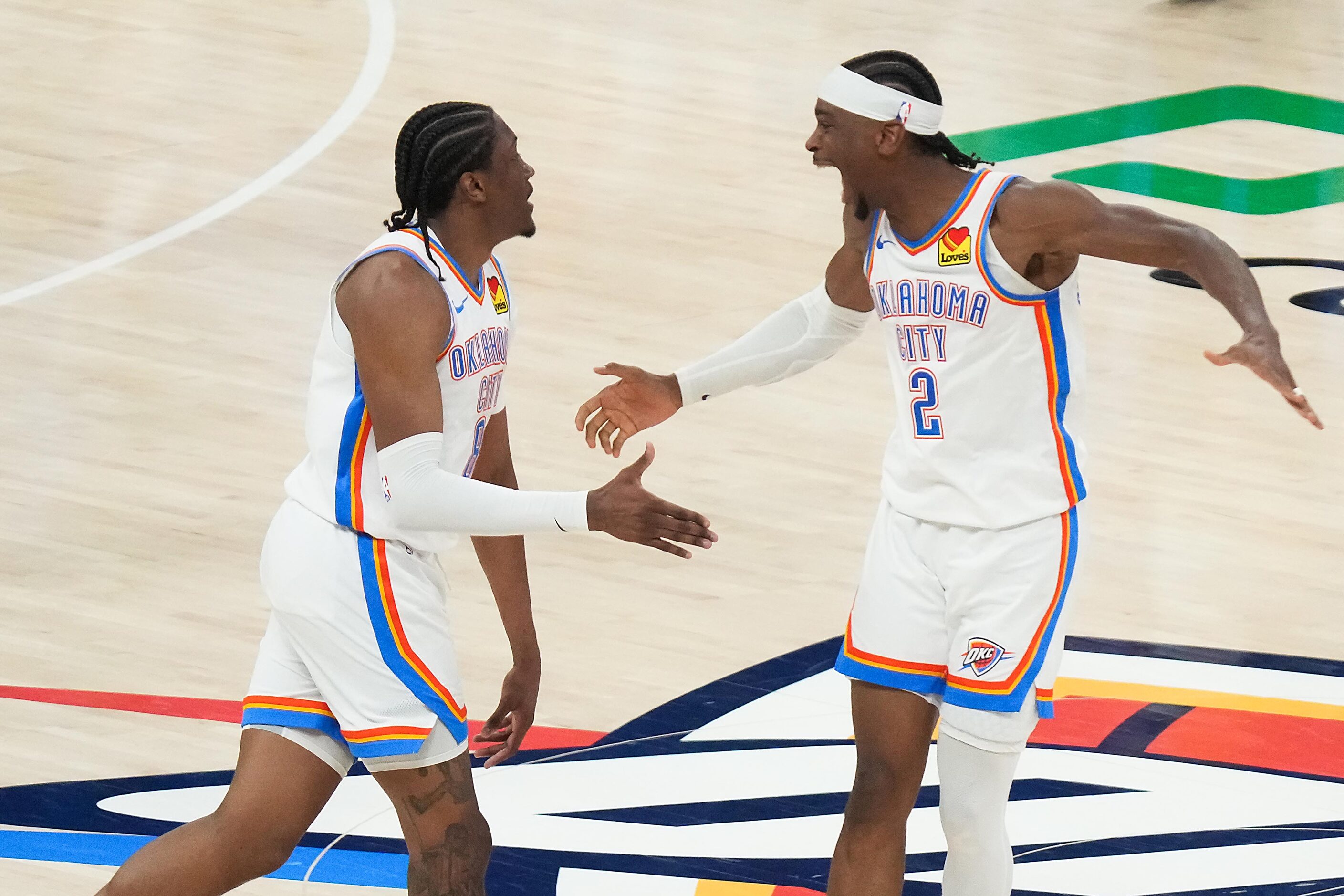 Oklahoma City Thunder guard Shai Gilgeous-Alexander (2) celebrates with forward Jalen...