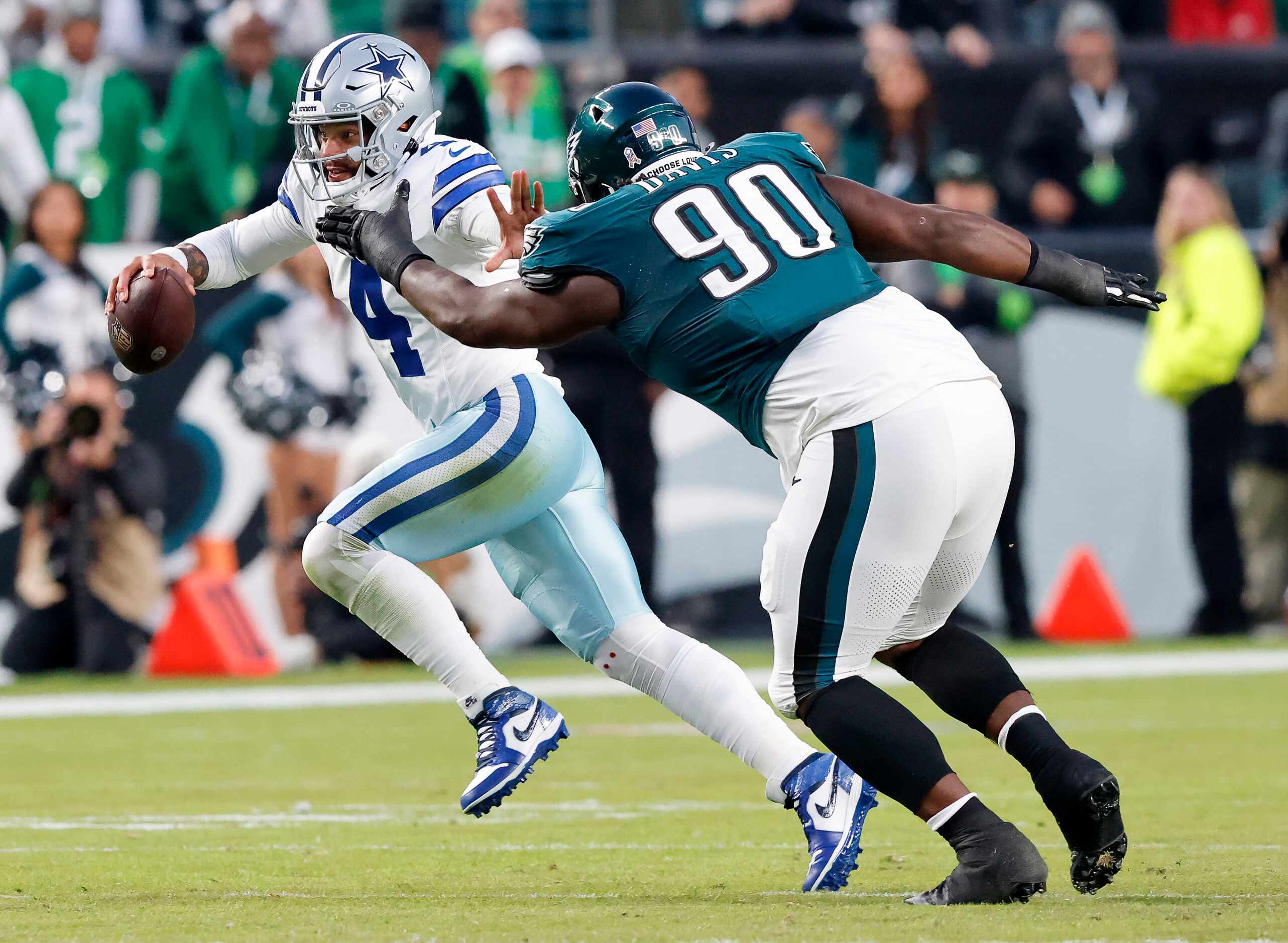 Dallas Cowboys quarterback Dak Prescott (4) eludes Philadelphia Eagles defensive tackle...
