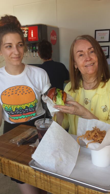 Jimmie Joyce Anderson (right) purchased the first Pints and Quarts burger on opening day.