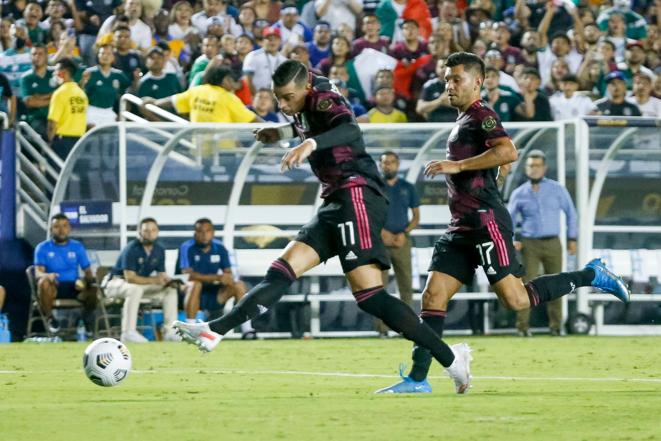 Mexico forward Rogelio Funes Mori (11) shoots the ball ahead of Mexico forward Jesús Corona...