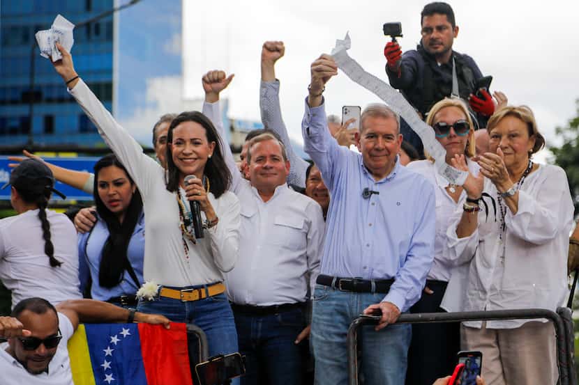 Opposition leader Maria Corina Machado, left, and opposition candidate Edmundo Gonzalez hold...