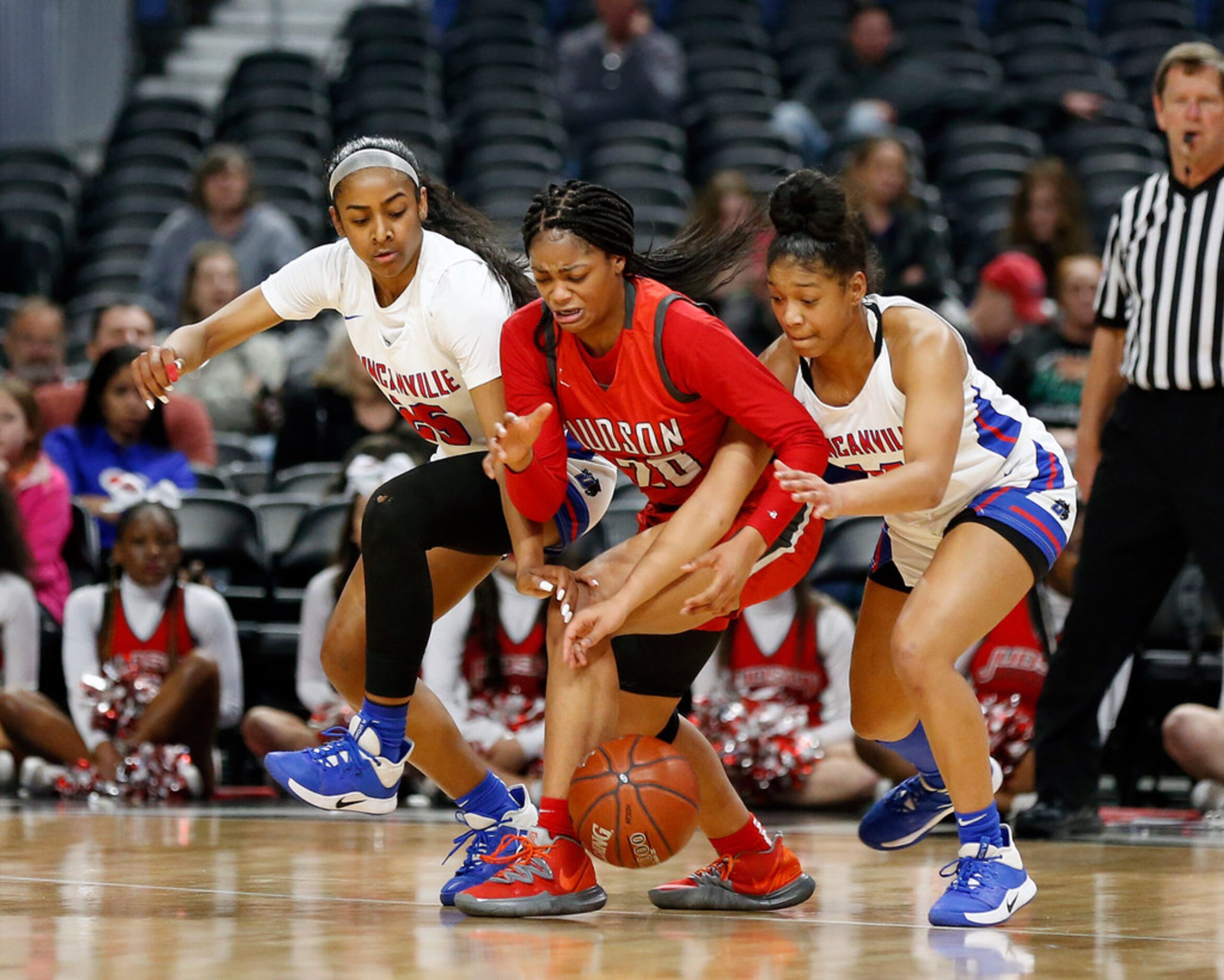 Duncanville guard Deja Kelly #25 and Duncanville guard Kiyara Howard-Garza #14 pressure...